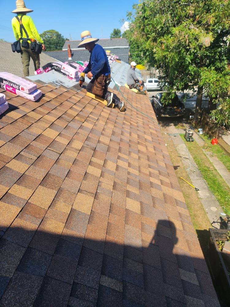 Crew laying new shingles